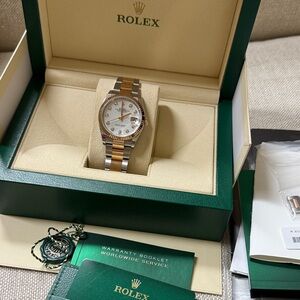 Rolex” “Datejust” stainless steel and 18 karat rose gold